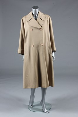 Lot 128 - A Balenciaga couture beige gabardine raincoat,...