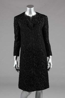 Lot 144 - An Yves Saint Laurent black cloqué evening...