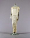 Lot 407 - A cream Fortuny Delphos pleated silk gown,...