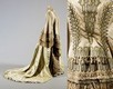 Lot 389 - A brocaded satin and brown silk gown circa...