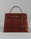 Lot 256 - A fine Hermès brown crocodile Kelly bag,...