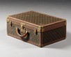 Lot 284 - A Louis Vuitton hard sided suitcase, French,...