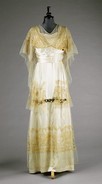 Lot 104 - A Paquin satin and blonde lace trimmed gown,...