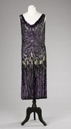 Lot 116 - A purple and black sequinned tabard, early...
