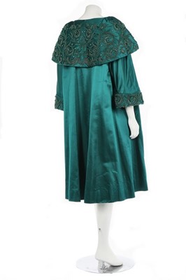 Lot 40 - A peacock-green satin evening coat, probably...