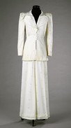 Lot 257 - An Ossie Clark cream wool suit, English, early...