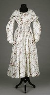 Lot 81 - A printed muslin summer gown, late 1830s, the...