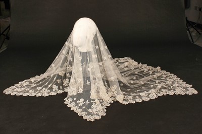 Lot 358 - A Honiton lace wedding veil, circa 1900, the...