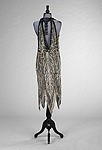 Lot 189 - A black and silver sequinned dress, originally...