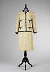 Lot 227 - A Chanel beige tweed and navy satin suit,...