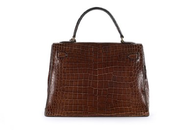 Lot 5 - An Hermès brown crocodile Kelly bag, 1962,...