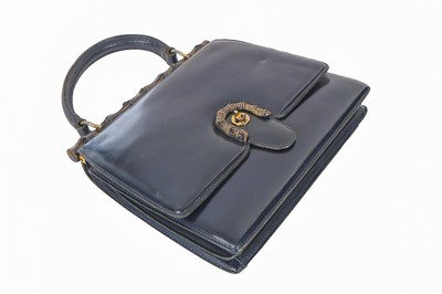 Lot 4 - A Gucci navy leather handbag, late 1950s-early...