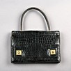 Lot 12 - An Hermès black crocodile `piano' handbag,...