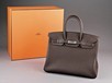 Lot 17 - An unused Hermès chocolate brown togo leather...