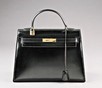 Lot 2 - An Hermès black leather rigid Kelly bag, late...