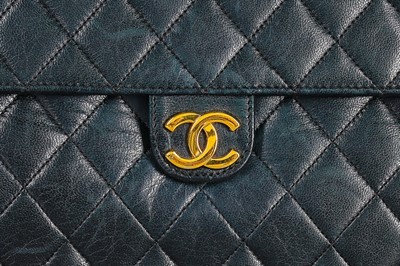 Lot 1 - A Chanel navy quilted lambskin leather flap...