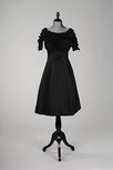 Lot 273 - A Givenchy black silk faille cocktail gown,...