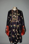Lot 103 - An embroidered informal robe, altered for...