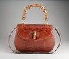 Lot 136 - A Gucci brown crocodile handbag, circa 1973,...