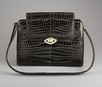 Lot 138 - A Gucci chocolate brown crocodile handbag,...