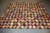 Lot 77 - A Log cabin patchwork coverlet, circa 1880-90,...