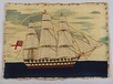 Lot 64 - A sailor's woolwork picture, mid 19th century,...