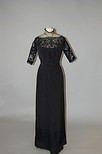 Lot 191 - A Worth black wool gown circa 1908, bearing...