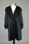 Lot 195 - A black satin coat, circa 1914-18, with...