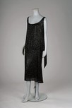 Lot 223 - A fine Chanel black beaded cocktail gown,...