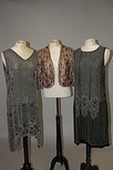 Lot 210 - Two beaded black chiffon flapper gowns, circa...