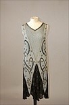 Lot 200 - A beaded flapper dress, circa 1928, of pale...