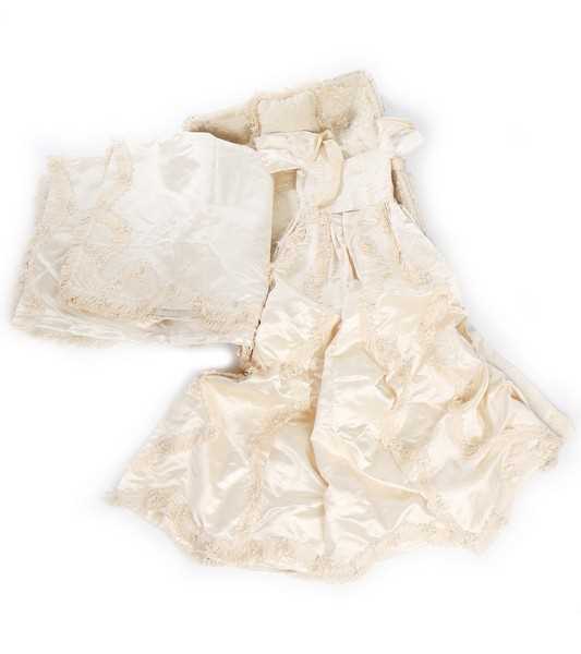 Click for high resolution Lot 27 - A quilted ivory silk layette basket and...