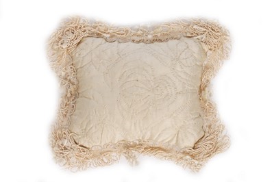 Lot 27 - A quilted ivory silk layette basket and...