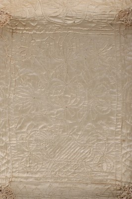Lot 27 - A quilted ivory silk layette basket and...