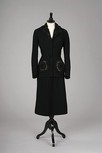 Lot 241 - A rare Robert Piguet black wool tailored suit,...