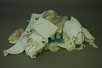 Lot 113 - A group of baby clothes and lace, dating from...