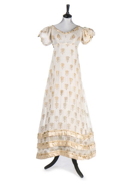 Lot 37 - A brocaded muslin evening dress, circa 1820,