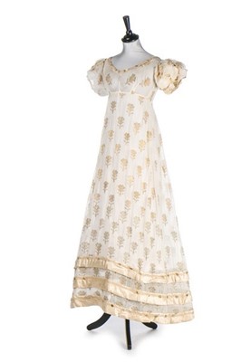 Lot 37 - A brocaded muslin evening dress, circa 1820,...