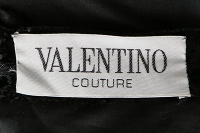 Lot 110 - A Valentino Garavani couture black ciré velvet...