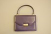 Lot 10 - A Gucci purple leather handbag, 1960s, stamped...