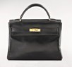 Lot 81 - An Hermès black leather Kelly bag, circa...