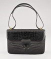 Lot 89 - A fine Hermès black crocodile `Dolly' bag,...