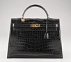 Lot 75 - A fine Hermès black crocodile Kelly bag, circa...