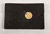 Lot 72 - A Cartier black suede pochette, circa 1930,...