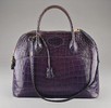 Lot 77 - An Hermès deep blue/purple crocodile handbag,...