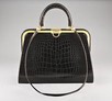 Lot 86 - A Christian Dior chocolate brown crocodile...