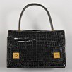 Lot 85 - An Hermès black crocodile `piano' handbag,...