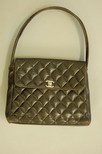 Lot 80 - A Chanel quilted brown leather handbag,...