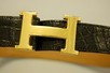 Lot 82 - An Hermès black crocodile belt, circa 1970,...