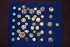 Lot 27 - A group of enamelled buttons, mainly French,...